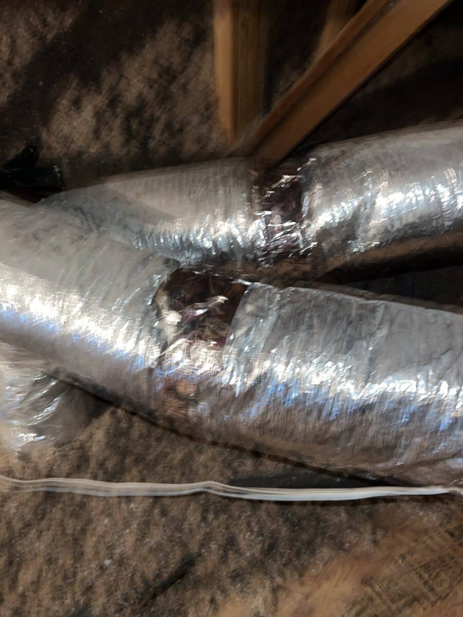 Insulated flex ductwork in residential attic showing proper duct installation and connection