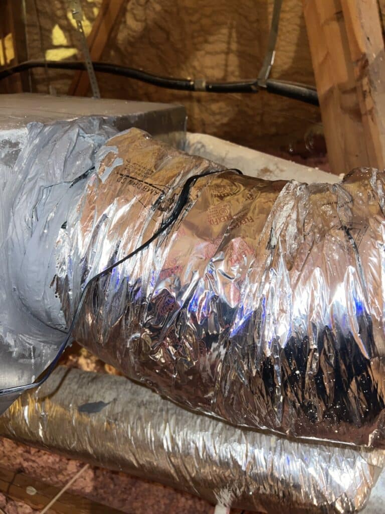 PureUV PURE-MX UV light air purifier installed on HVAC ductwork with blue LED indicator light active