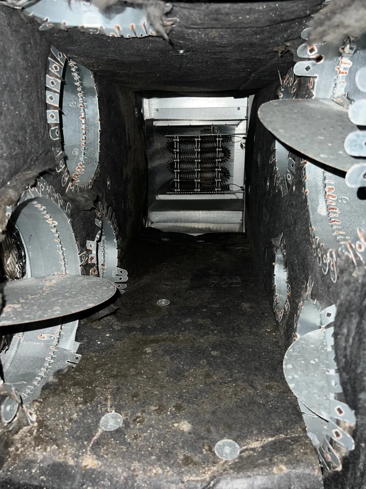 Plenum box restoration: plenum interior with heating elements visible and takeoff collars along the walls
