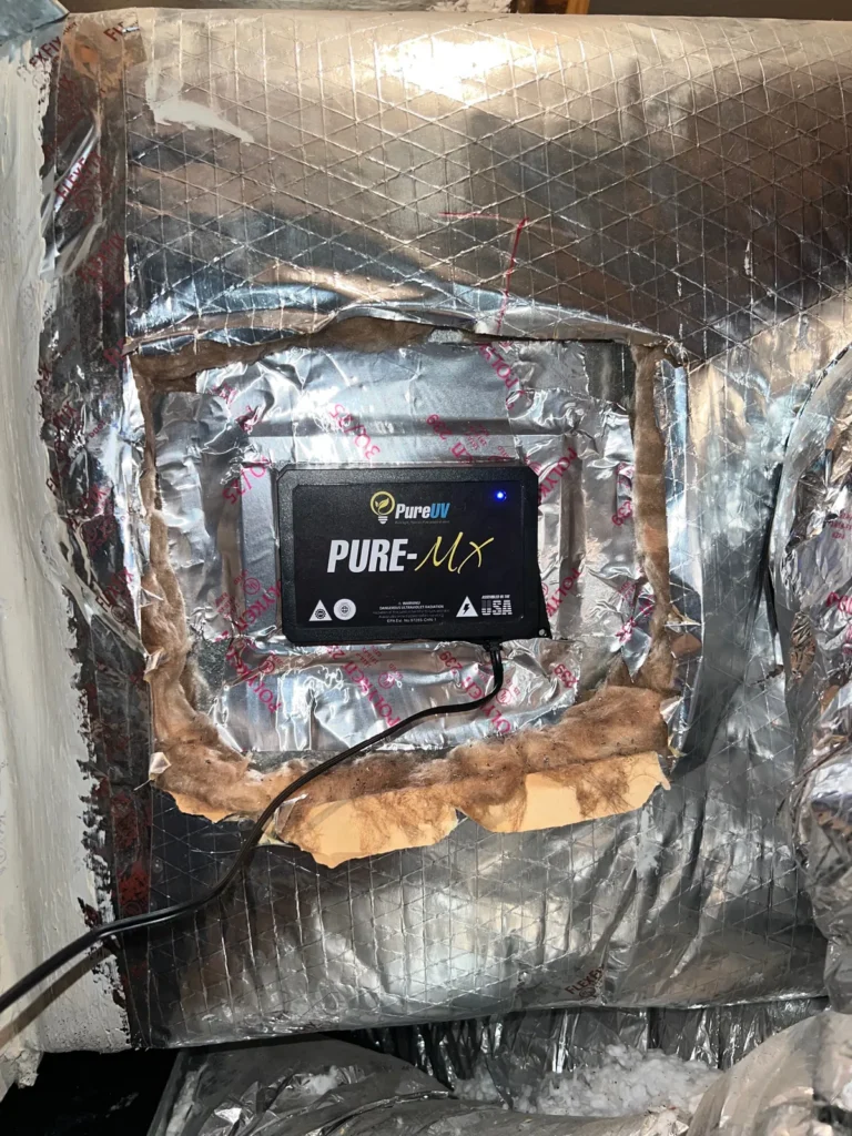UV light installation: Pure UV MX unit set into a cut opening in foil-faced ductboard