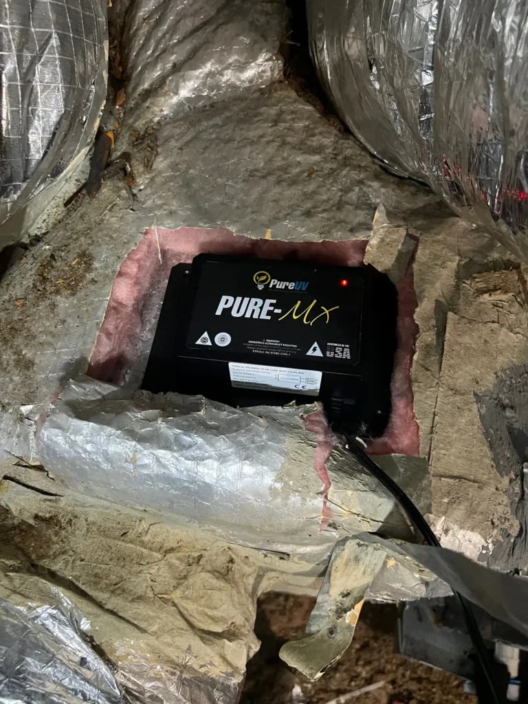 UV light installation: Pure UV MX purifier with power light mounted in insulated attic ductwork